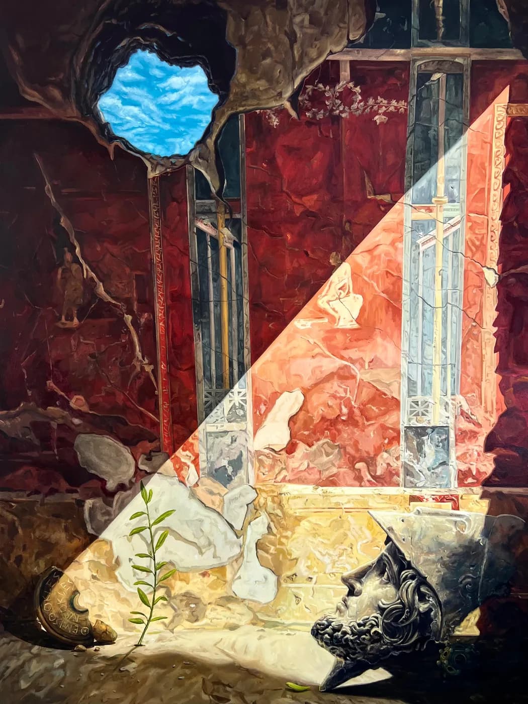 A diagonal shaft of light falls across a flaking red fresco wall; below, a helmeted bronze head lies beside an olive sprig, and a hole in the wall opens onto blue sky.